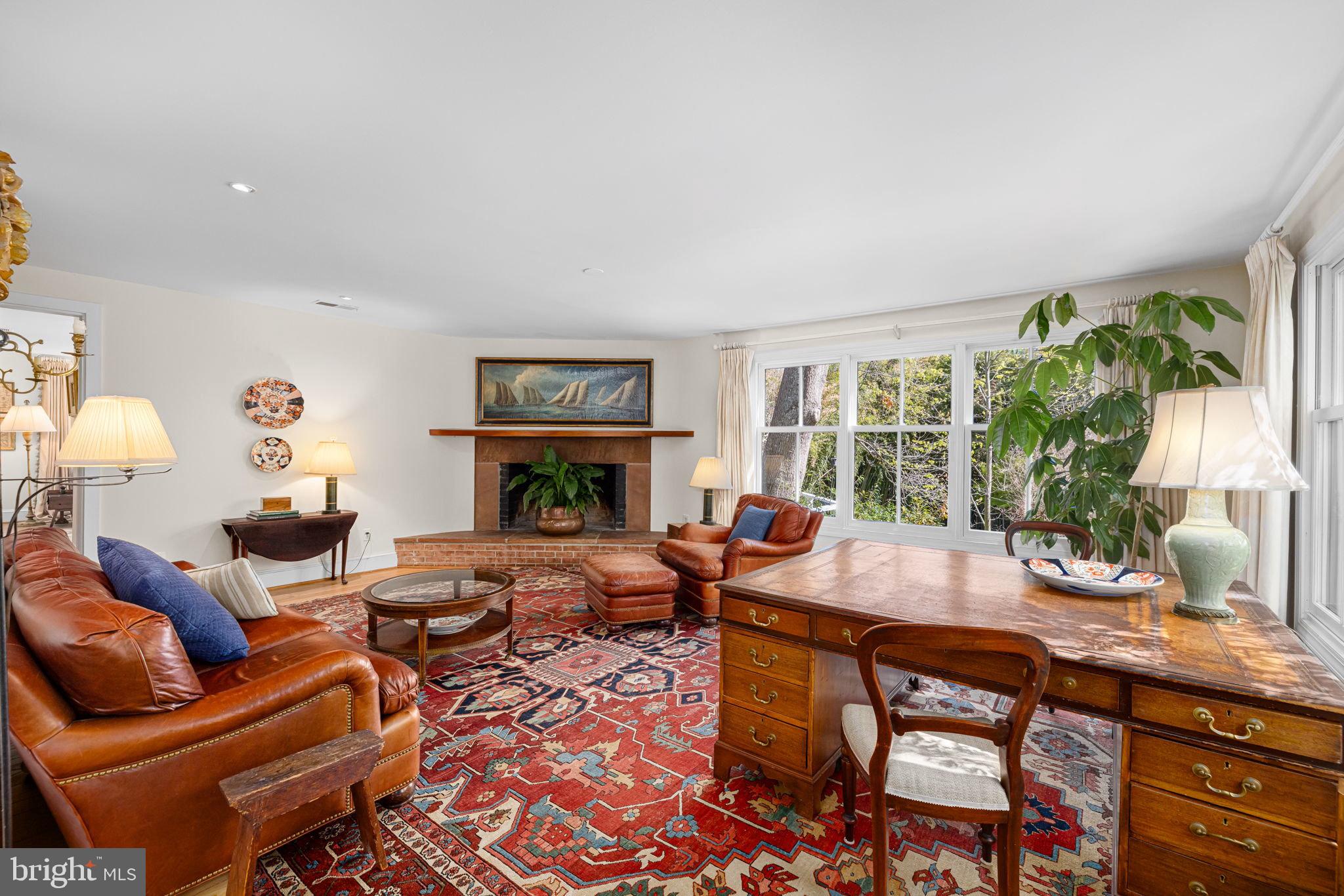 6139 Franklin Park Road McLean, VA 22101 - Photo 11 of 49 a living room with furniture a fireplace and a potted plant