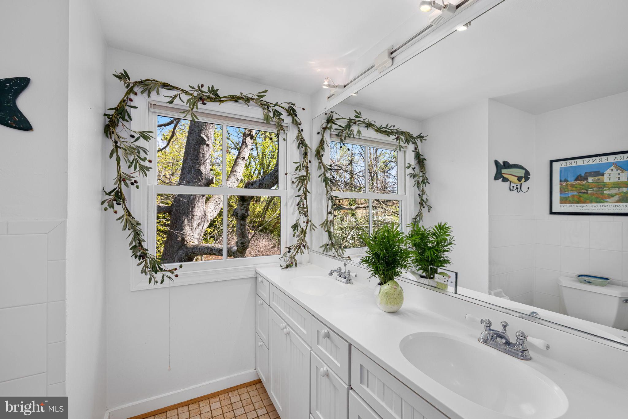 6139 Franklin Park Road McLean, VA 22101 - Photo 18 of 49 a bathroom with a sink double vanity and a mirror