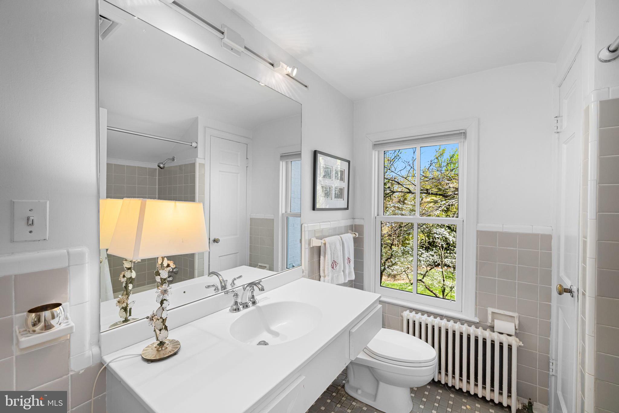 6139 Franklin Park Road McLean, VA 22101 - Photo 36 of 49 a bathroom with a sink a toilet and a window