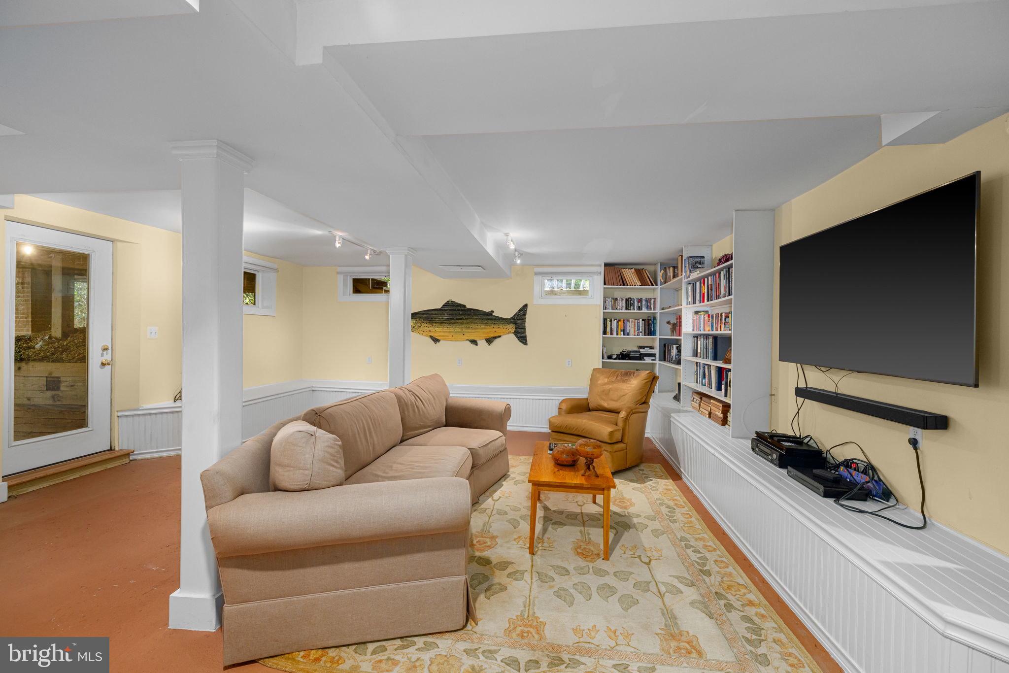 6139 Franklin Park Road McLean, VA 22101 - Photo 39 of 49 a living room with furniture and a flat screen tv