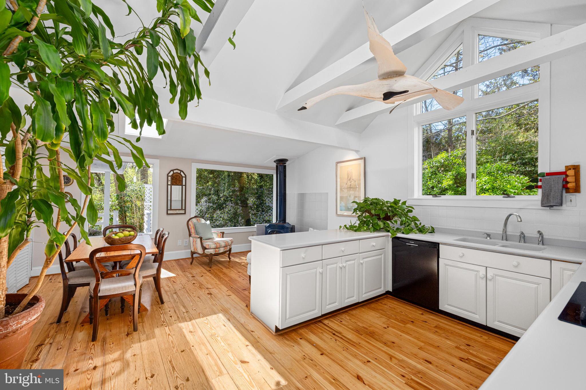 6139 Franklin Park Road McLean, VA 22101 - Photo 6 of 49 a view of a kitchen with a sink and dishwasher with wooden floor