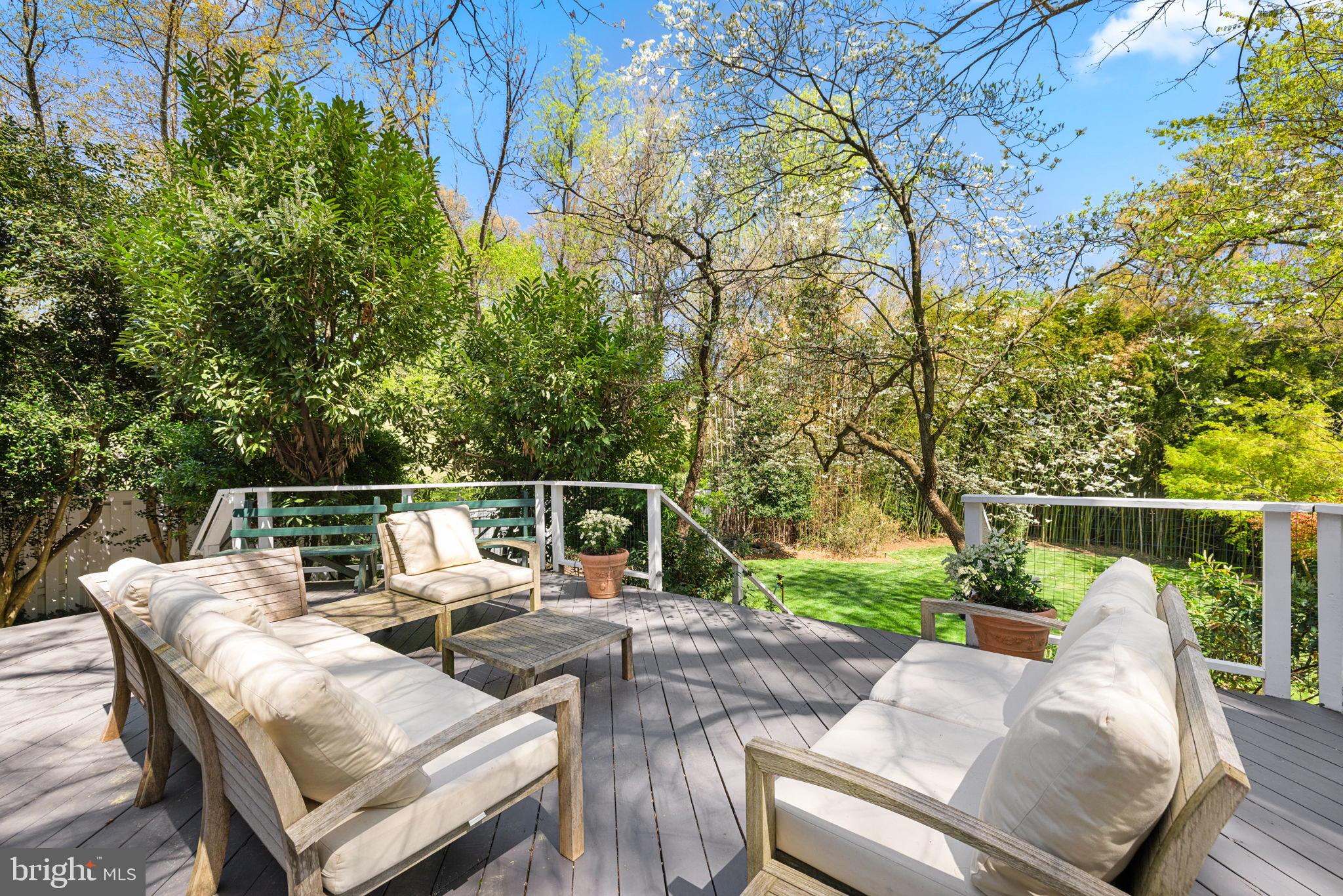 6139 Franklin Park Road McLean, VA 22101 - Photo 10 of 49 a view of a patio with couches chairs and a table and chairs with wooden fence