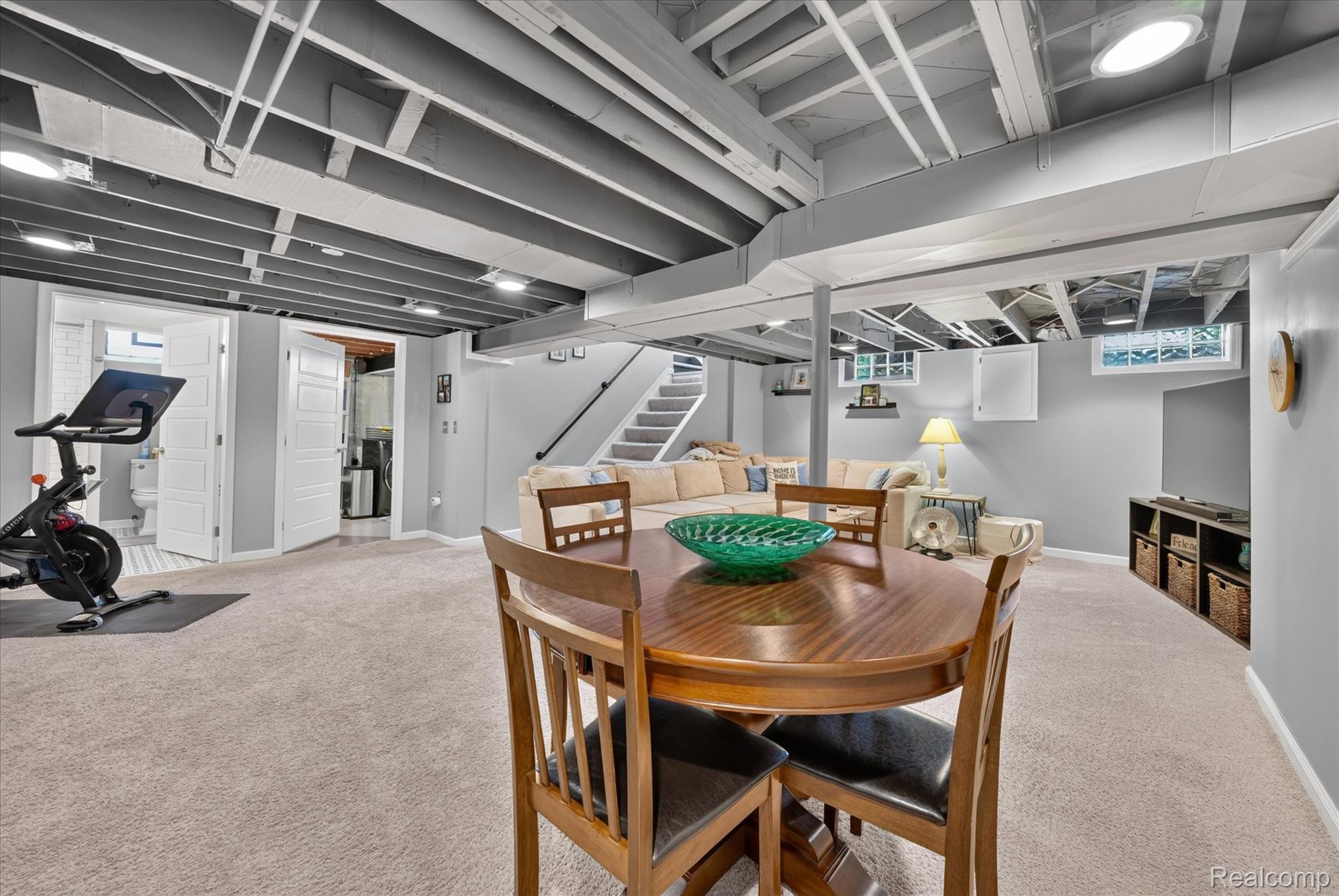 4112 Durham Road Royal Oak, MI 48073 - Photo 25 of 38 Carpeted recreation area with recessed lighting, exposed ceiling joists, and a built-in shelving unit