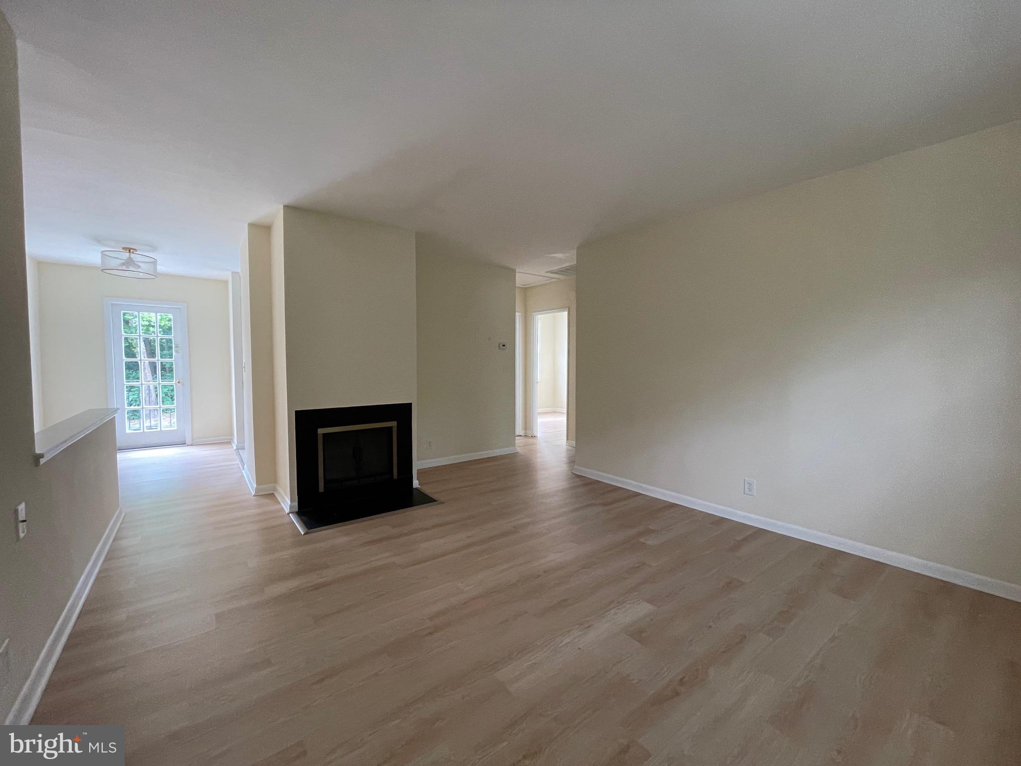 2515 South Walter Reed Drive, Unit D Arlington, VA 22206 - Photo 4 of 10 Living room with fireplace for cozy winter evening