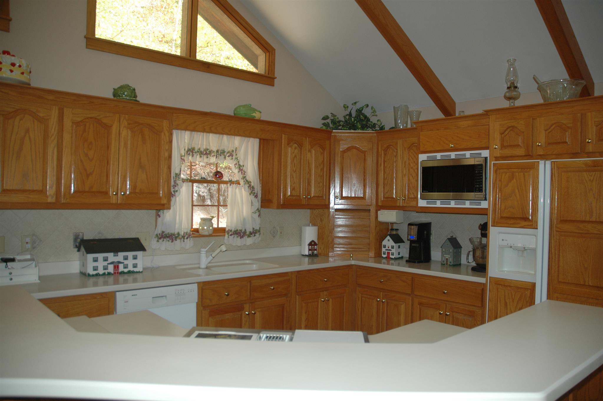 8765 Griffith Road Nashville, TN 37221 - Photo 3 of 27 Stunning custom made cabinets with Corian counter tops