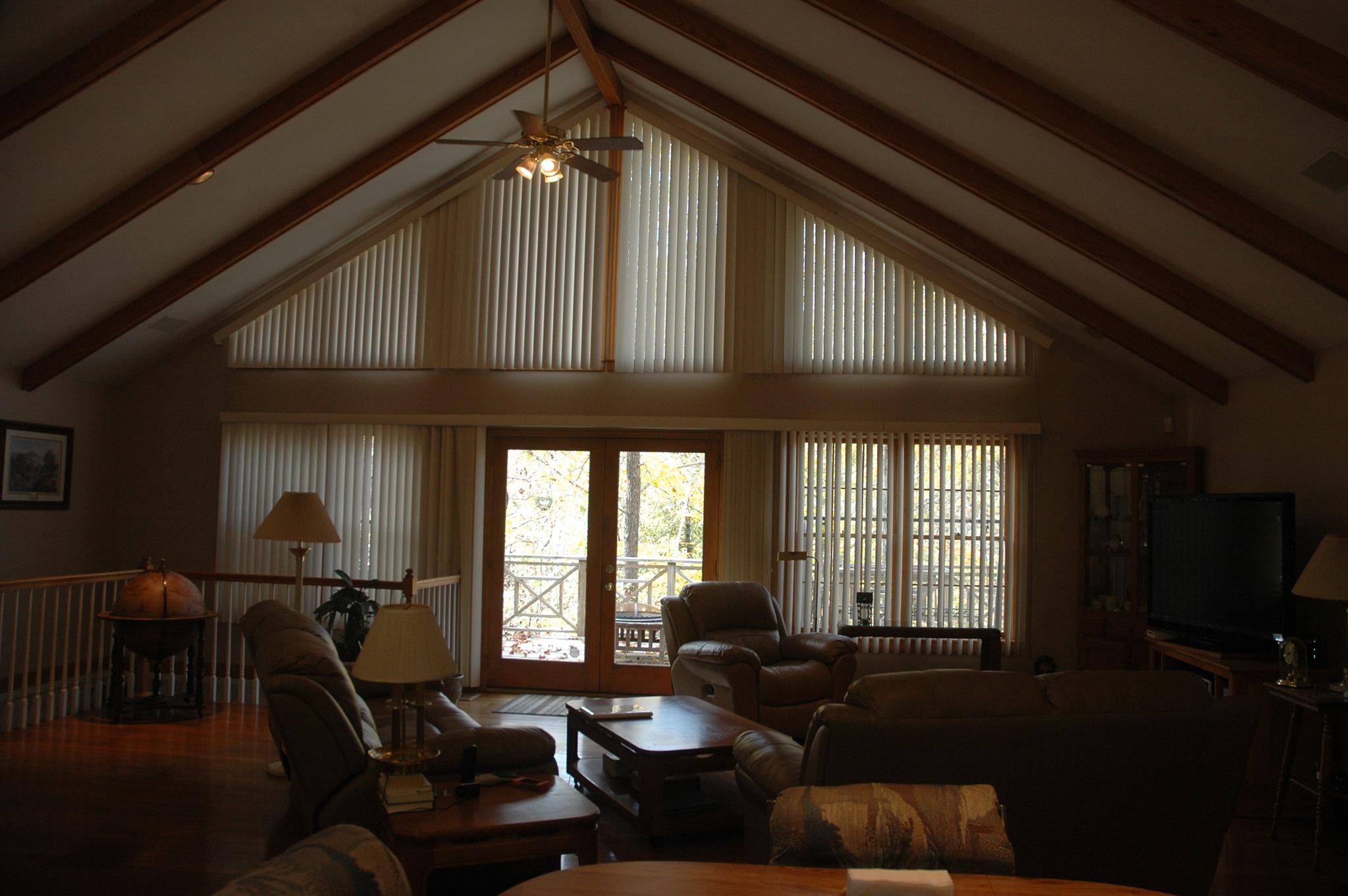 8765 Griffith Road Nashville, TN 37221 - Photo 21 of 27 Living room with french door to deck. All custom made blinds to stay with home.