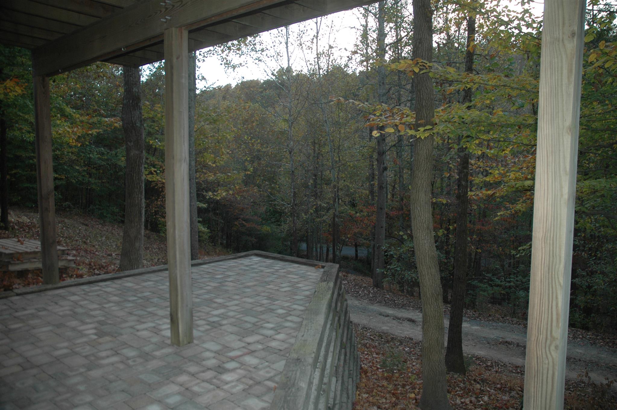 8765 Griffith Road Nashville, TN 37221 - Photo 25 of 27 Hand laid brick pavers below deck