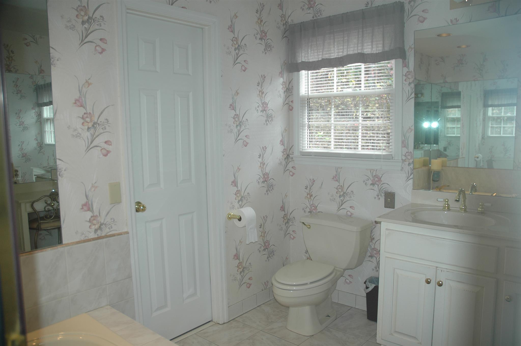 8765 Griffith Road Nashville, TN 37221 - Photo 9 of 27 Notice the operable window above the water closet