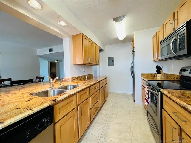 a kitchen with a table and chairs in it