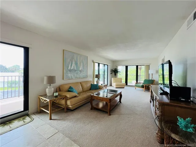 a view of balcony with wooden floor and outdoor seating