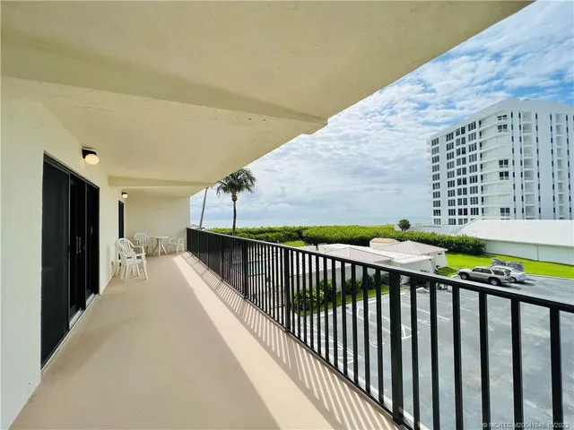 a bathroom with a sink toilet a mirror and shower curtain