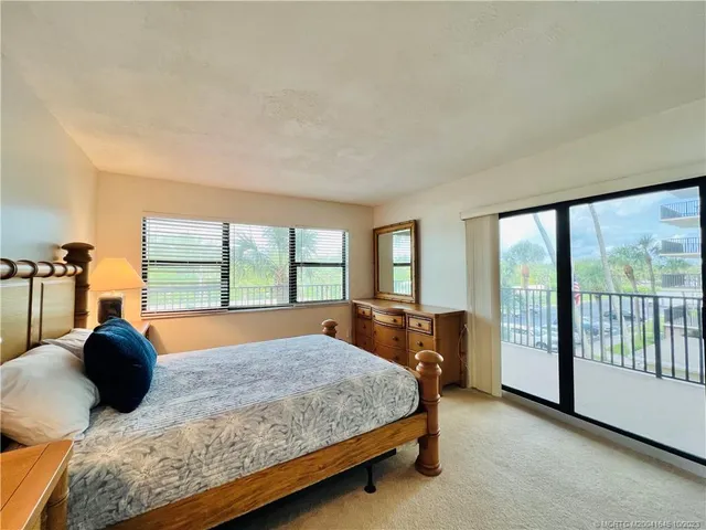 a view of swimming pool with seating area and barbeque oven