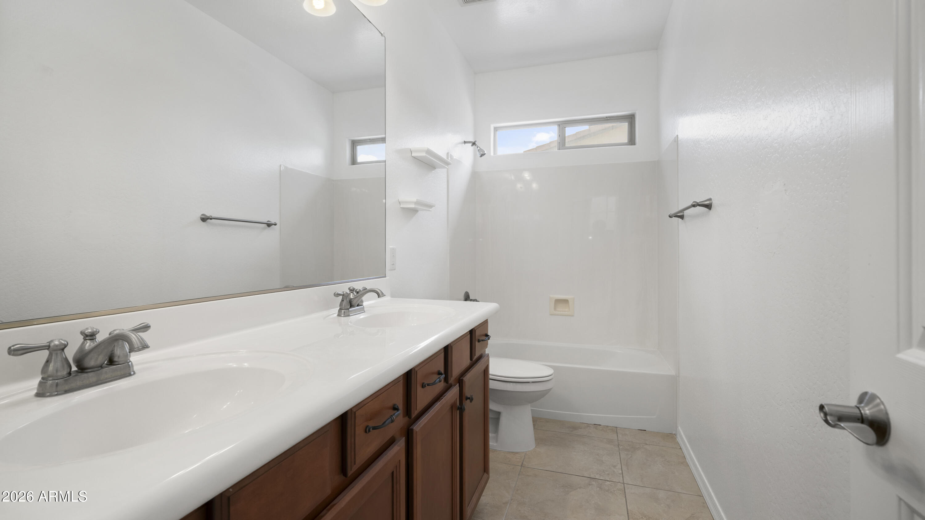 16159 West Granada Road Goodyear, AZ 85395 - Photo 34 of 41 a bathroom with a sink vanity granite and toilet