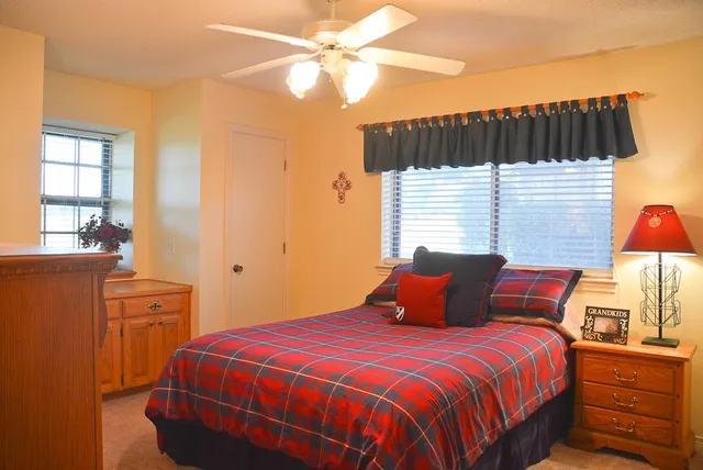 a bedroom with a bed and a closet