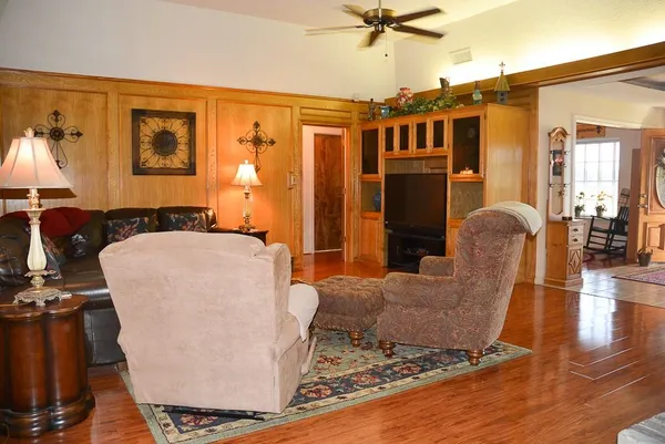 a living room with furniture and a window