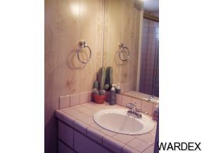 10067 Rio Vista Road Parker, AZ 85344 - Photo 5 of 10 a bathroom with a granite countertop sink and a mirror
