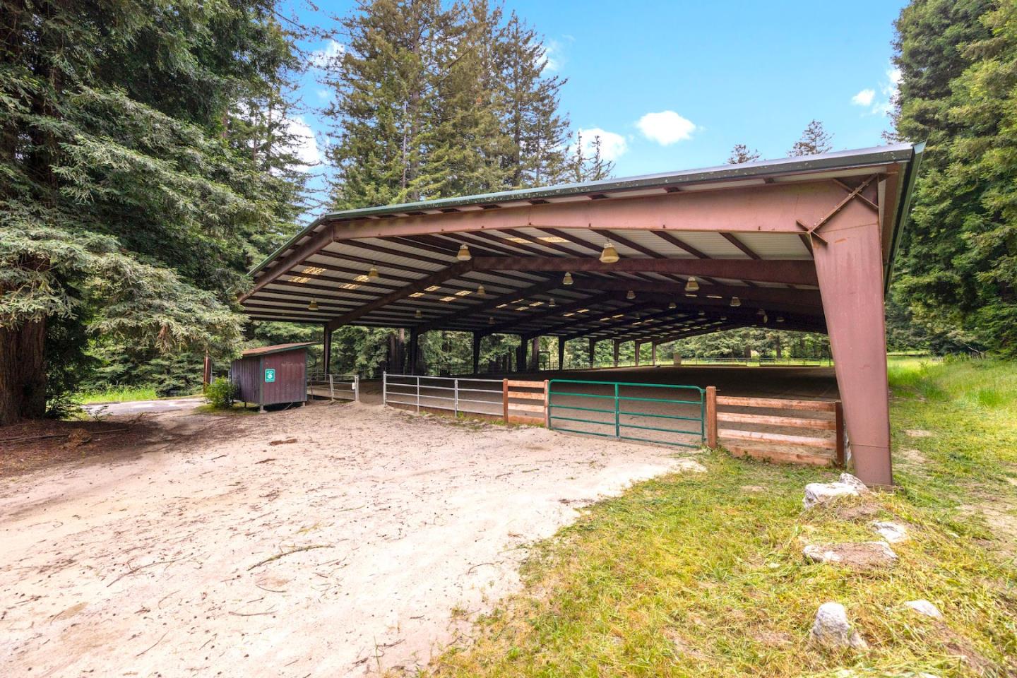 3675 Bonny Doon Road Santa Cruz, CA 95060 - Photo 20 of 59 a view of patio with a table and chairs under an umbrella