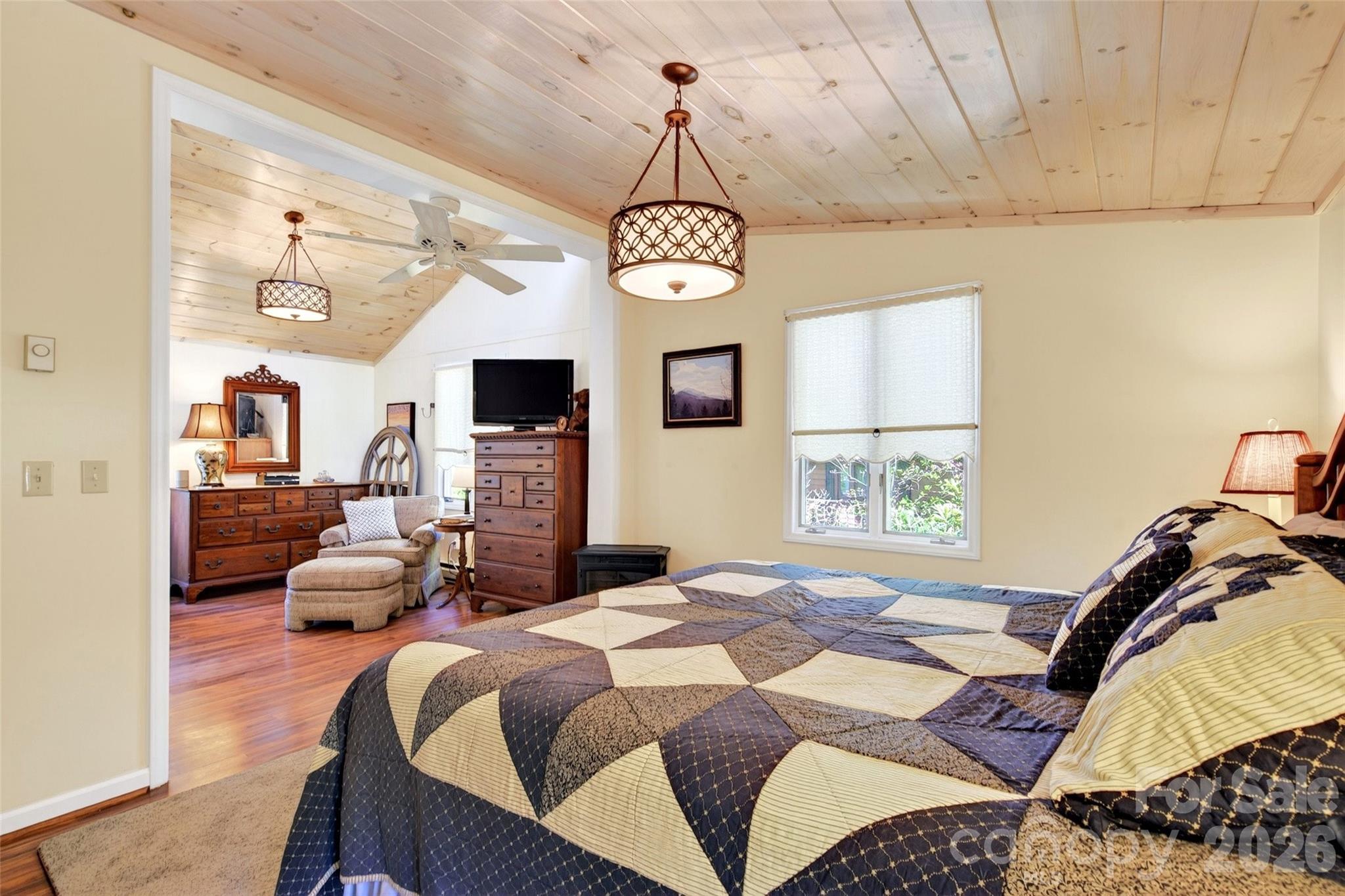 334 Harbor Lake Road Newland, NC 28657 - Photo 22 of 48 a bedroom with a bed chandelier and a window