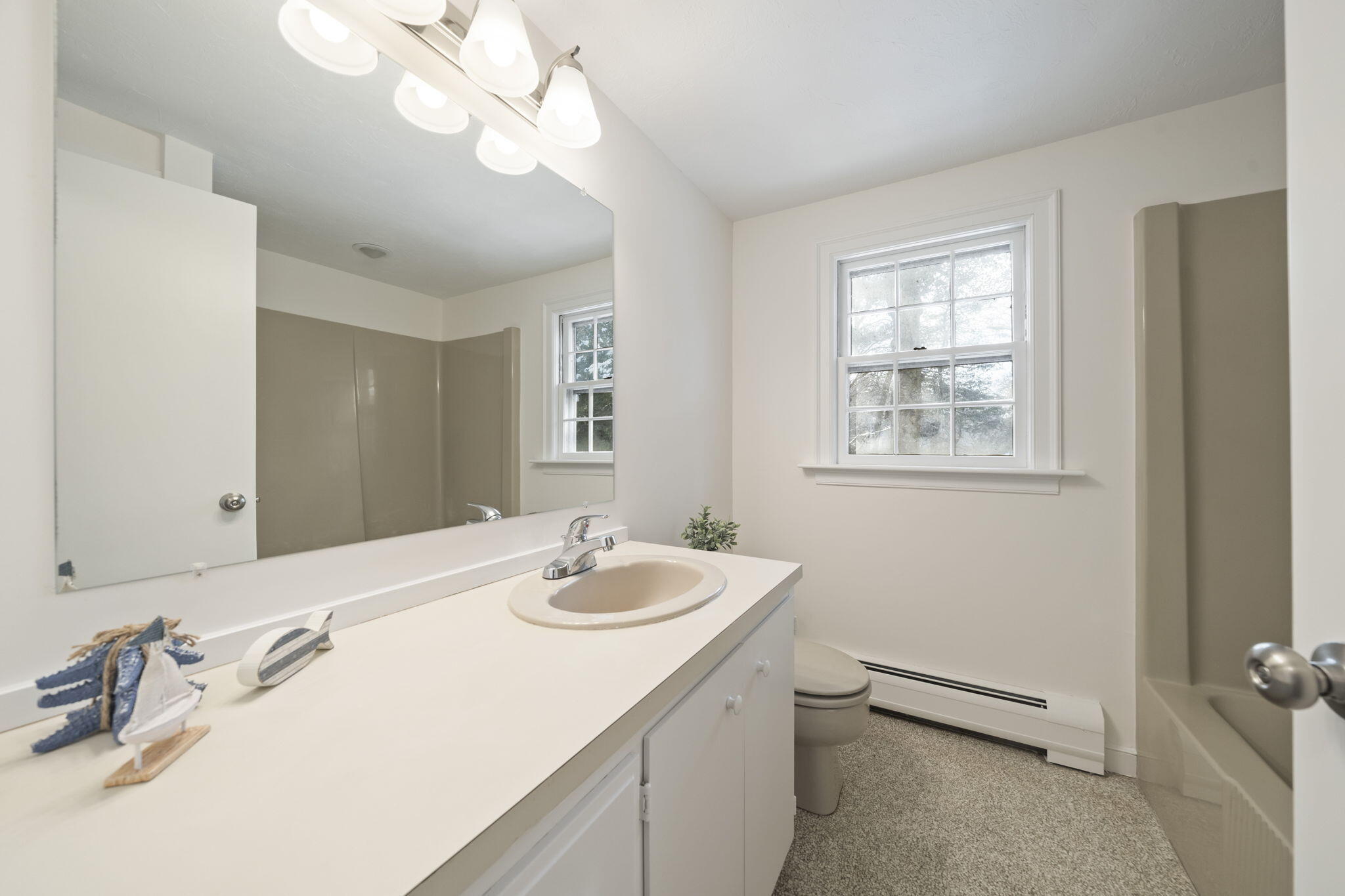 10 Sail -A-Way Barnstable, MA 02632 - Photo 20 of 32 a bathroom with a sink vanity and a mirror