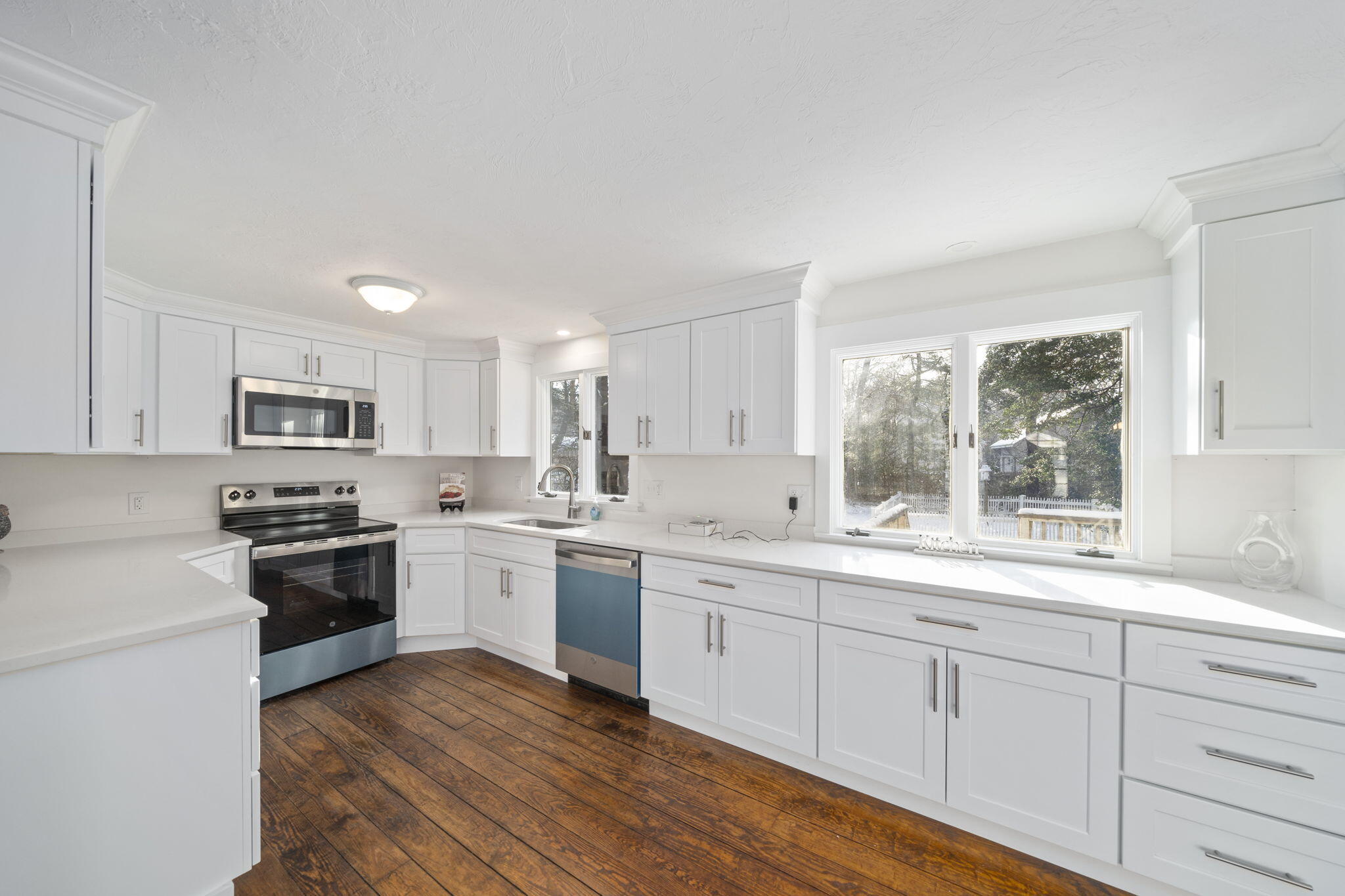10 Sail -A-Way Barnstable, MA 02632 - Photo 4 of 32 a large kitchen with cabinets wooden floor and a window