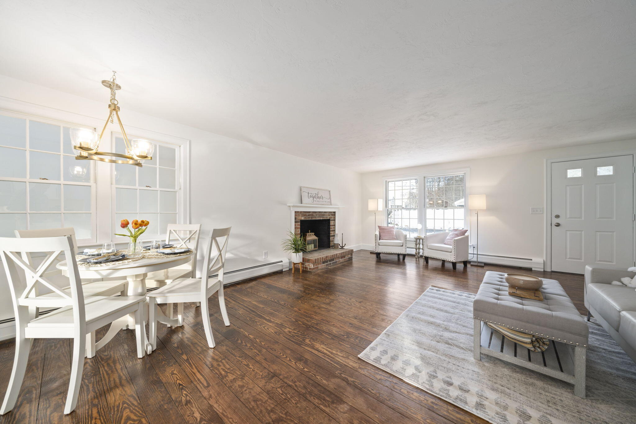 10 Sail -A-Way Barnstable, MA 02632 - Photo 7 of 32 a living room with furniture a fireplace and wooden floor