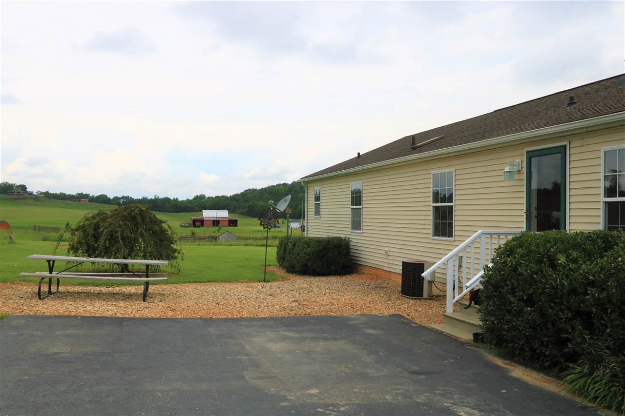 954 Quick's Mill Road Staunton, VA 24401 - Photo 17 of 45 a view of a house with a yard and a garden