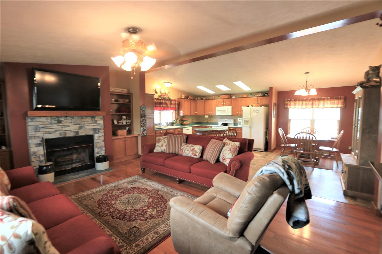 954 Quick's Mill Road Staunton, VA 24401 - Photo 25 of 45 a living room with furniture a flat screen tv and a fireplace