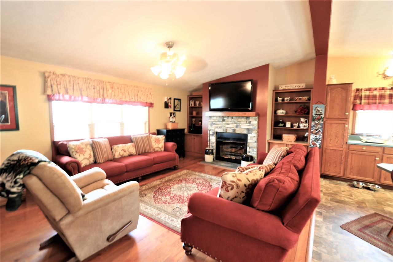 954 Quick's Mill Road Staunton, VA 24401 - Photo 28 of 45 a living room with furniture a flat screen tv and a fireplace