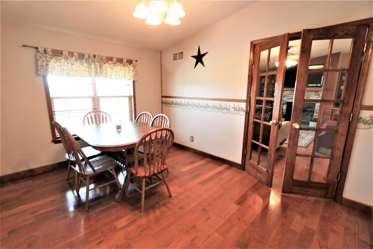 954 Quick's Mill Road Staunton, VA 24401 - Photo 29 of 45 a view of a dining room with furniture window and wooden floor