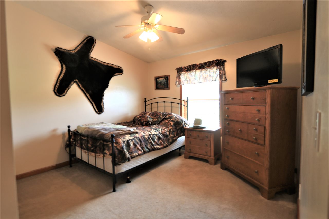 954 Quick's Mill Road Staunton, VA 24401 - Photo 42 of 45 a bedroom with a bed and a flat screen tv