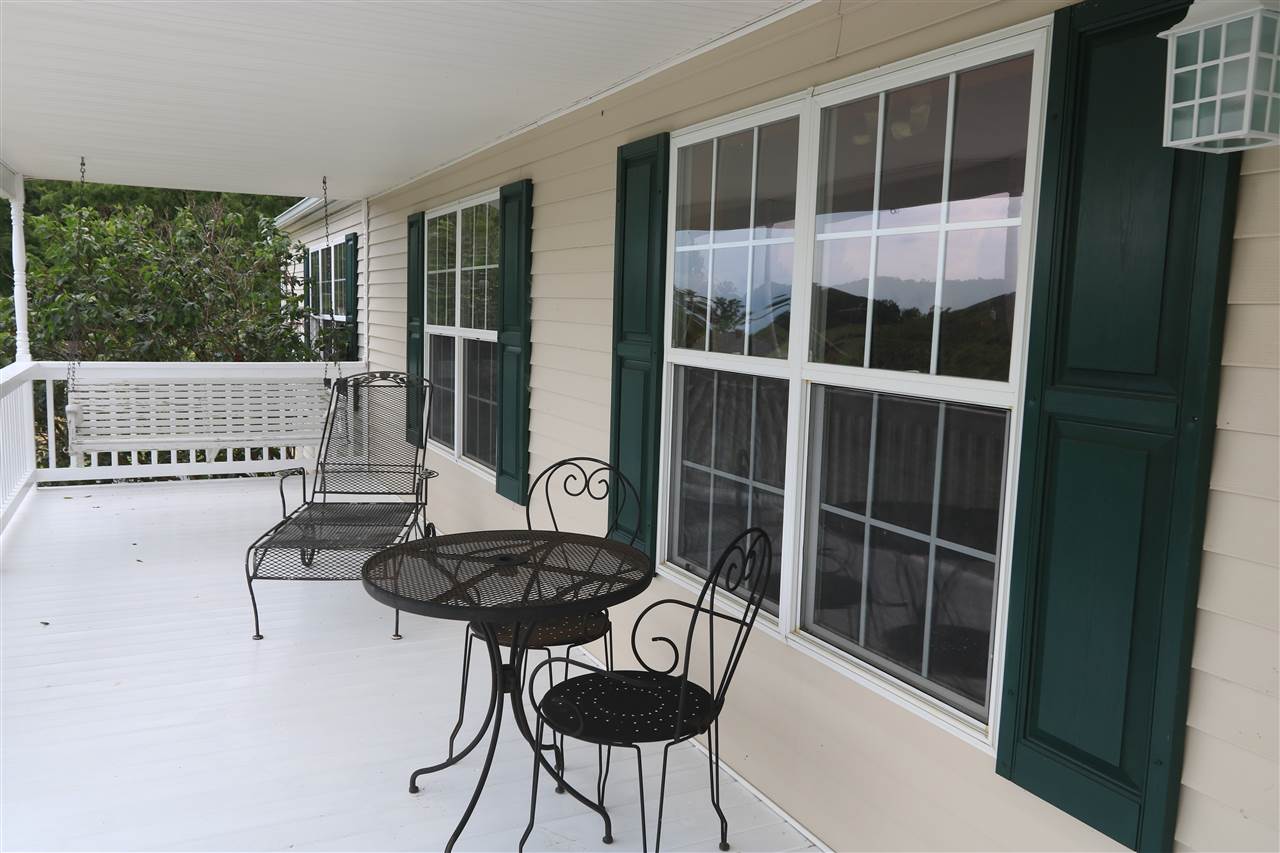954 Quick's Mill Road Staunton, VA 24401 - Photo 8 of 45 a view of a chair and tables in the balcony
