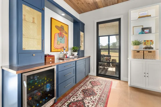 a spacious bathroom with a double vanity sink and a large mirror