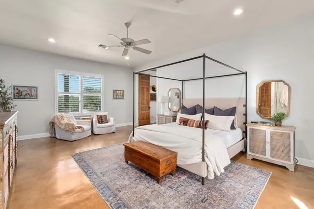 a bedroom with a bed and a couch