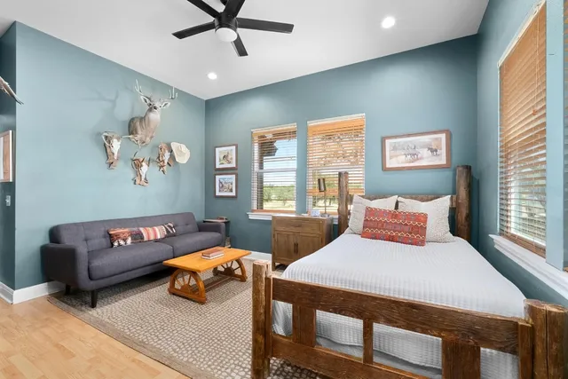 a bedroom with a bed furniture and a window