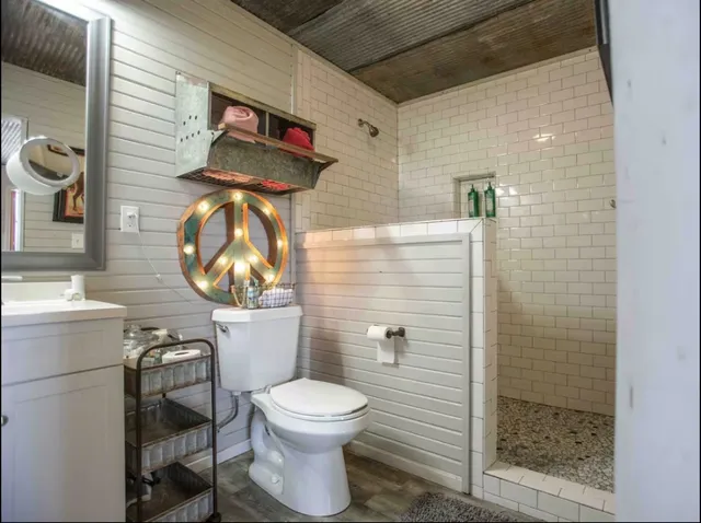 a bathroom with a toilet and a sink