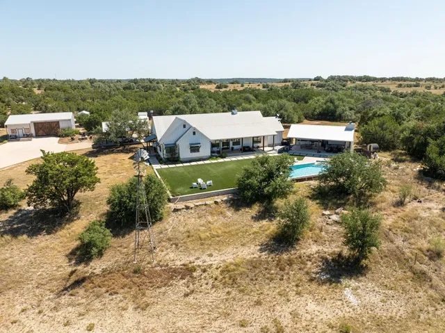 an aerial view of a house with a garden