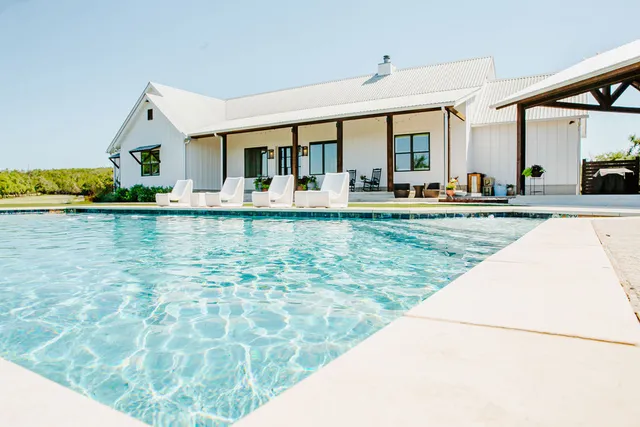 a view of swimming pool with outdoor seating