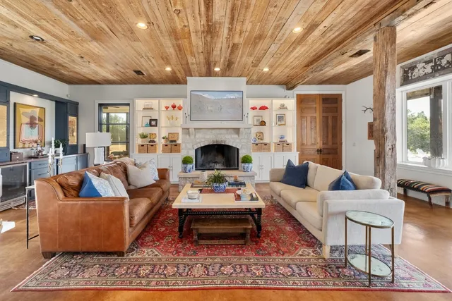 a living room with furniture and a fireplace