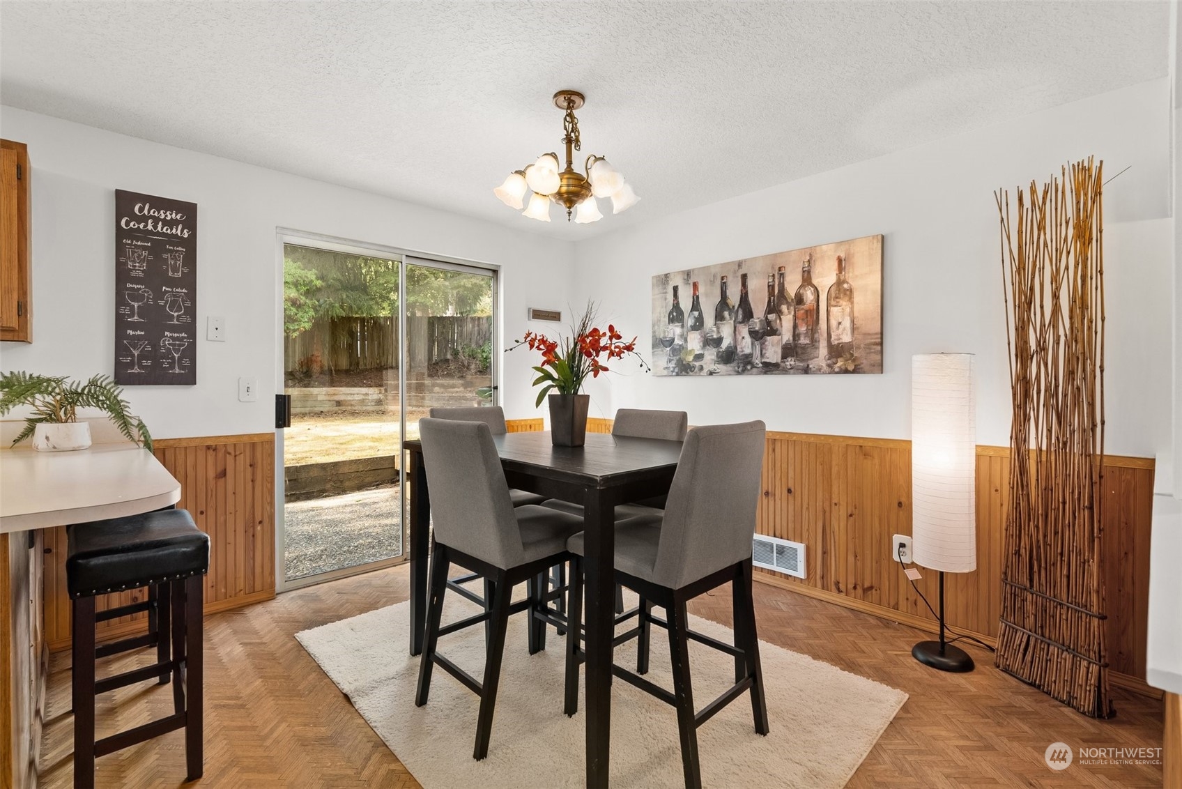 16530 3rd Drive Southeast Bothell, WA 98012 - Photo 13 of 40 a view of a dining room with furniture a chandelier and wooden floor