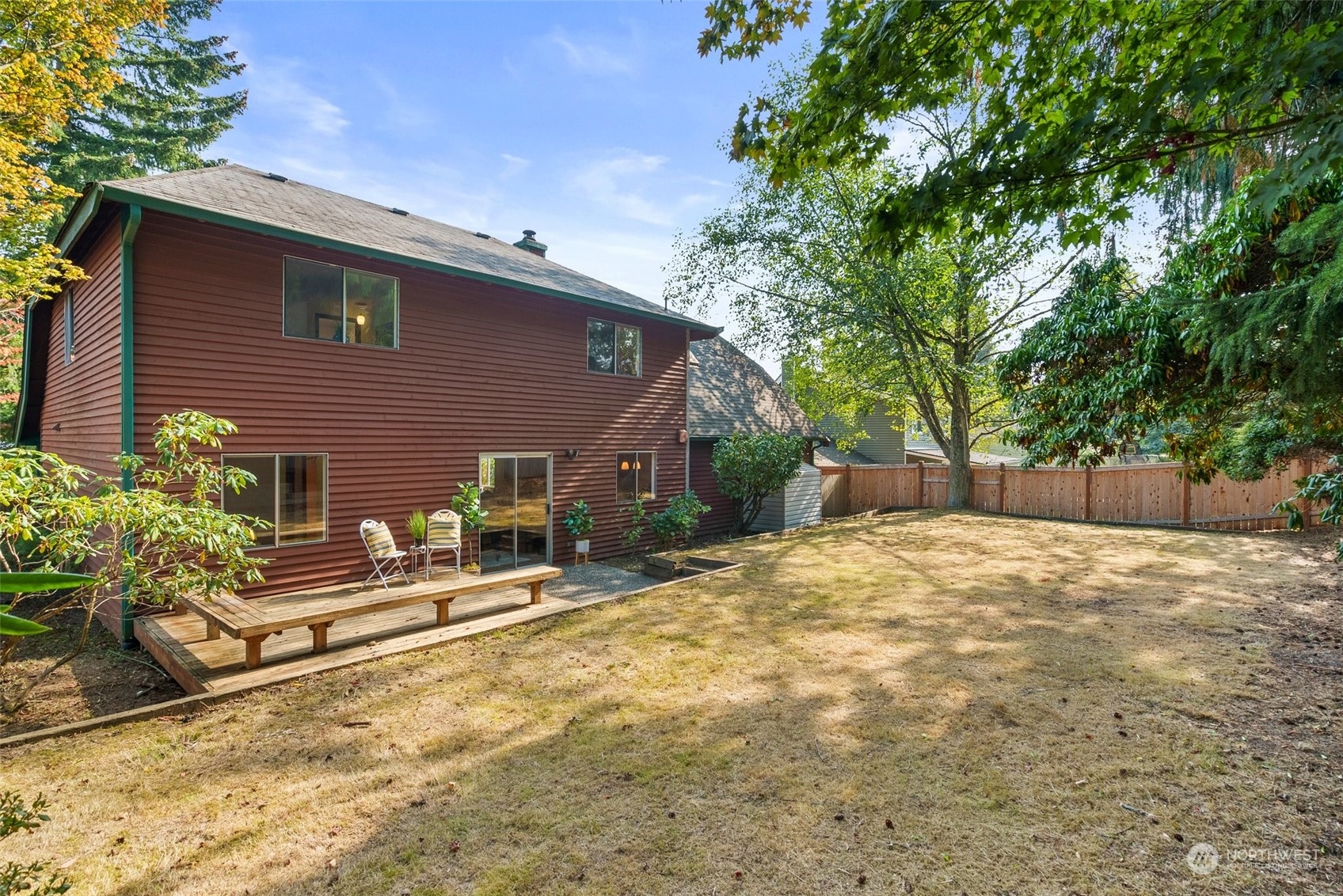 16530 3rd Drive Southeast Bothell, WA 98012 - Photo 17 of 40 a backyard of a house with trees and outdoor seating