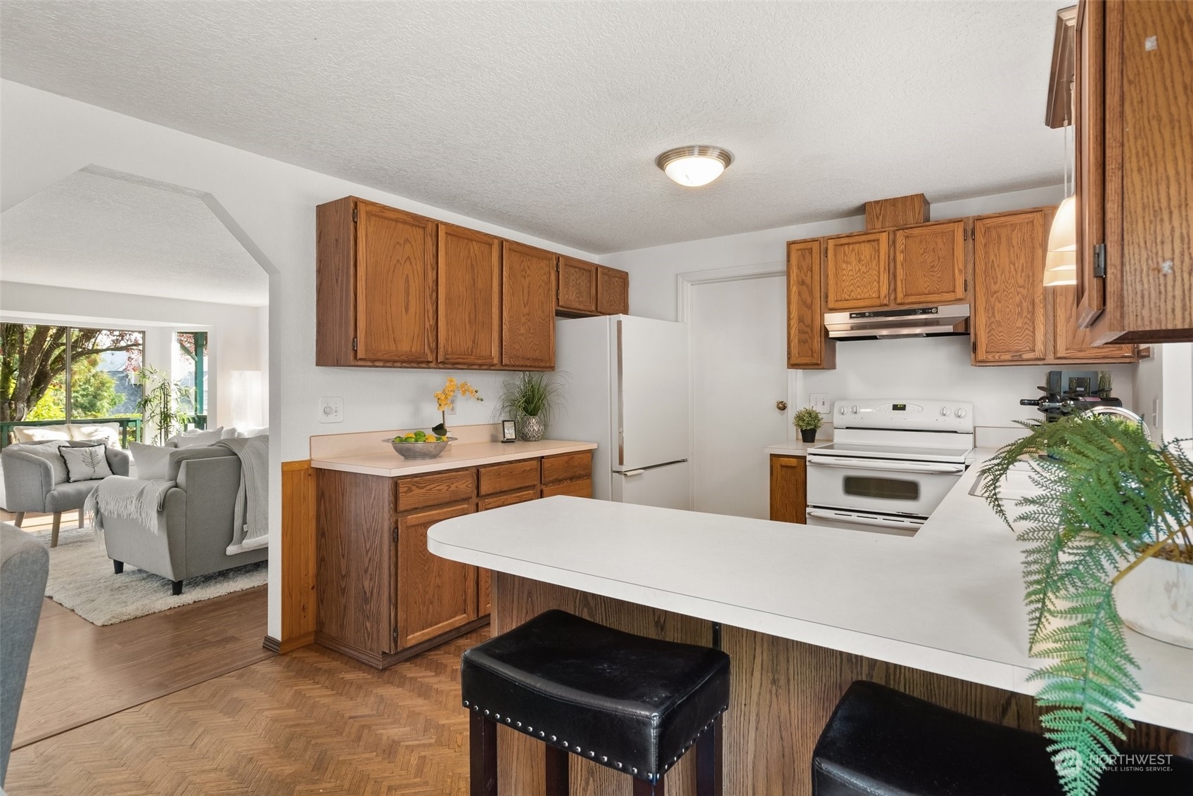 16530 3rd Drive Southeast Bothell, WA 98012 - Photo 18 of 40 a kitchen with stainless steel appliances a stove a sink a microwave a refrigerator and cabinets
