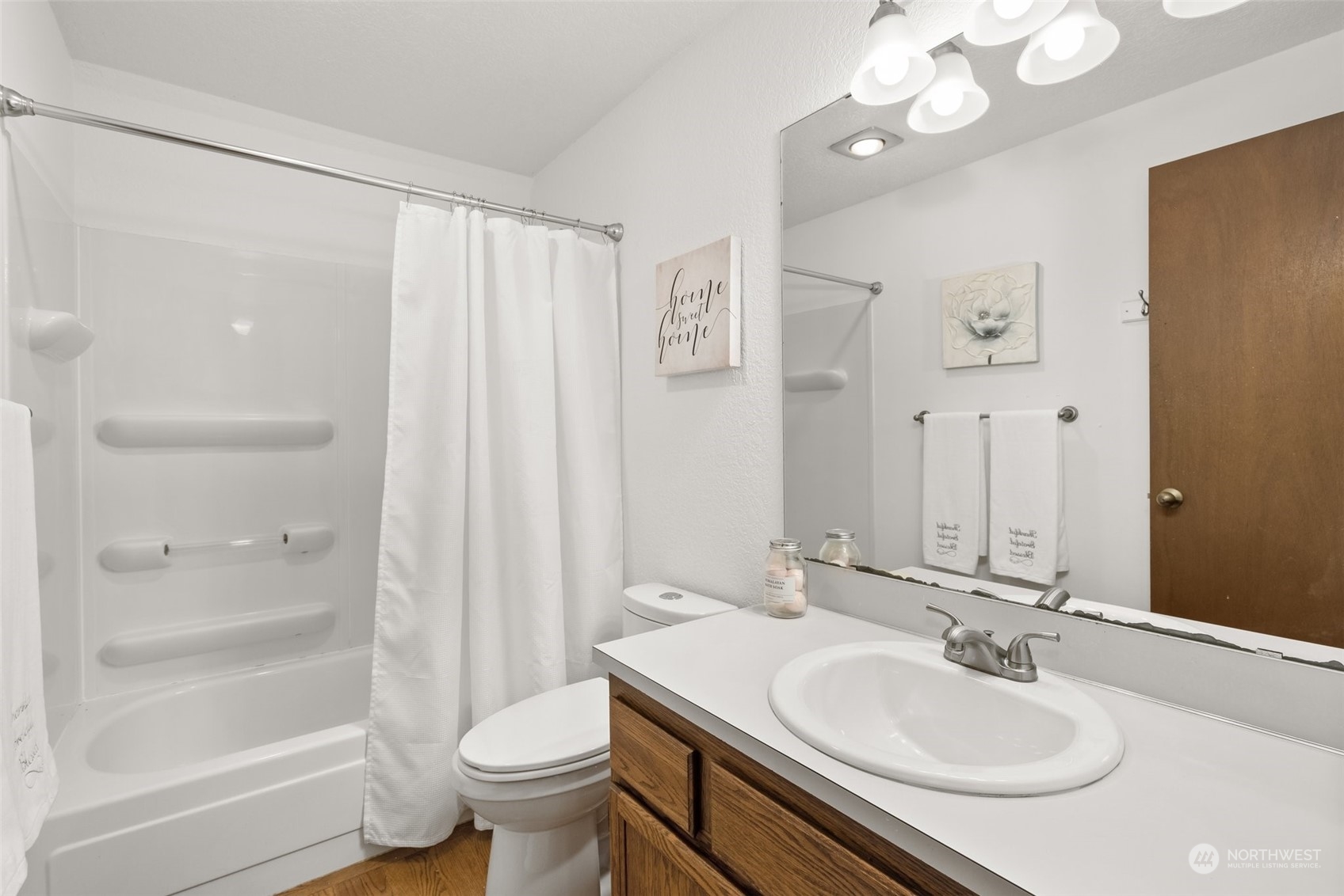 16530 3rd Drive Southeast Bothell, WA 98012 - Photo 29 of 40 a bathroom with a sink a toilet and a large mirror
