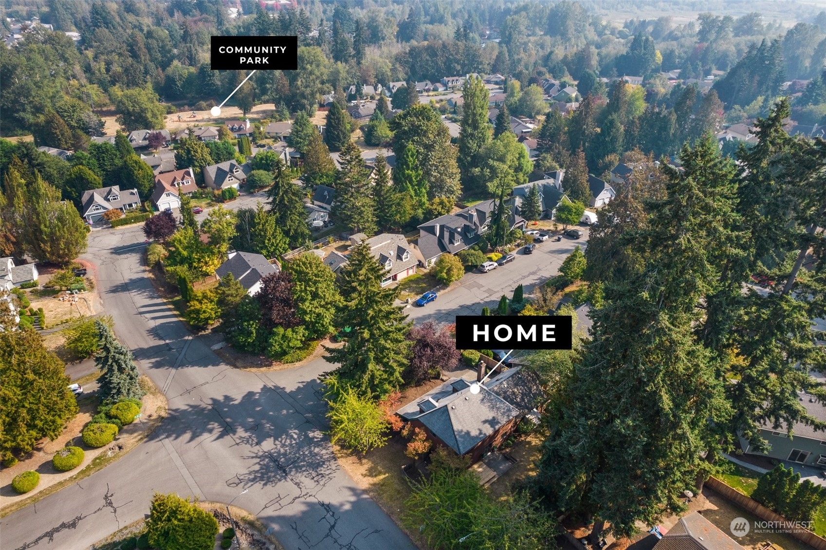 16530 3rd Drive Southeast Bothell, WA 98012 - Photo 3 of 40 a sign that is sitting on a brick wall