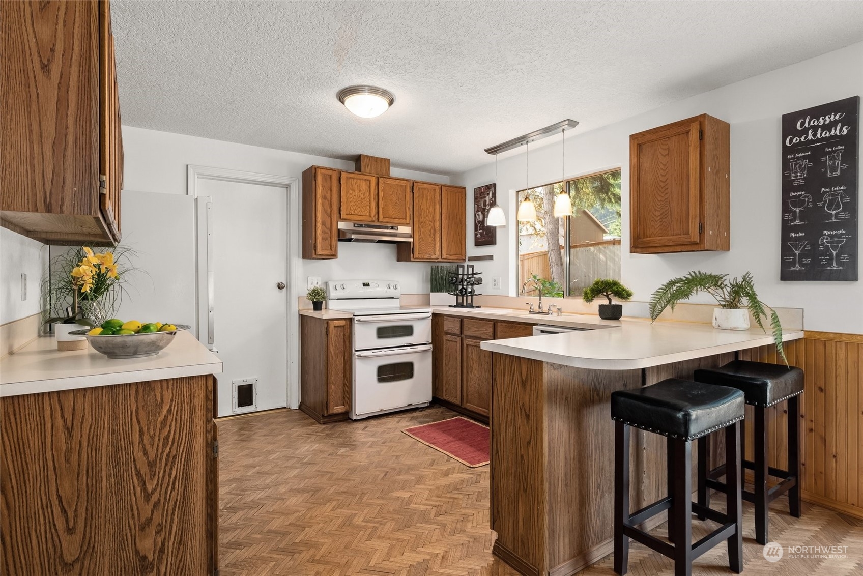 16530 3rd Drive Southeast Bothell, WA 98012 - Photo 10 of 40 a kitchen with a sink a stove a refrigerator and a stove