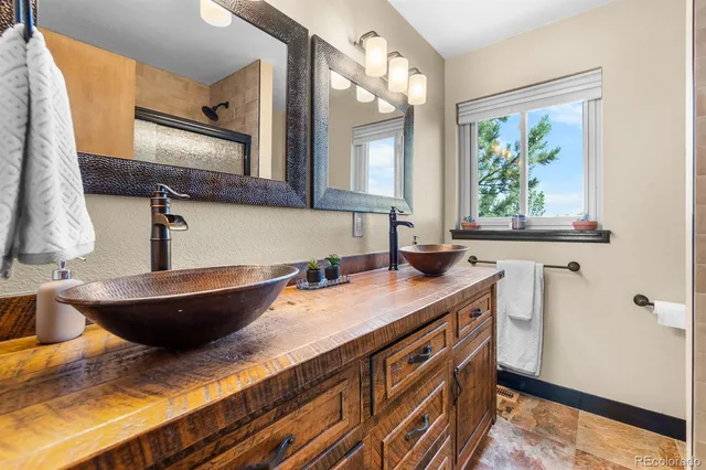 a bedroom with furniture and a gym equipment