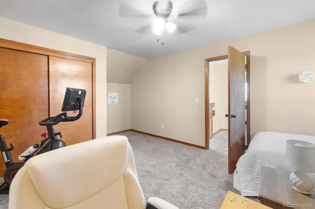 a view of a livingroom with a book shelf