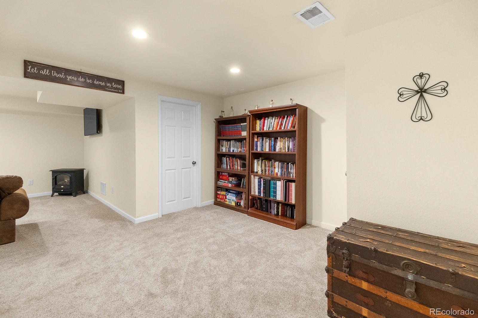 3163 Windstream Lane Elizabeth, CO 80107 - Photo 23 of 48 a view of a livingroom with a book shelf