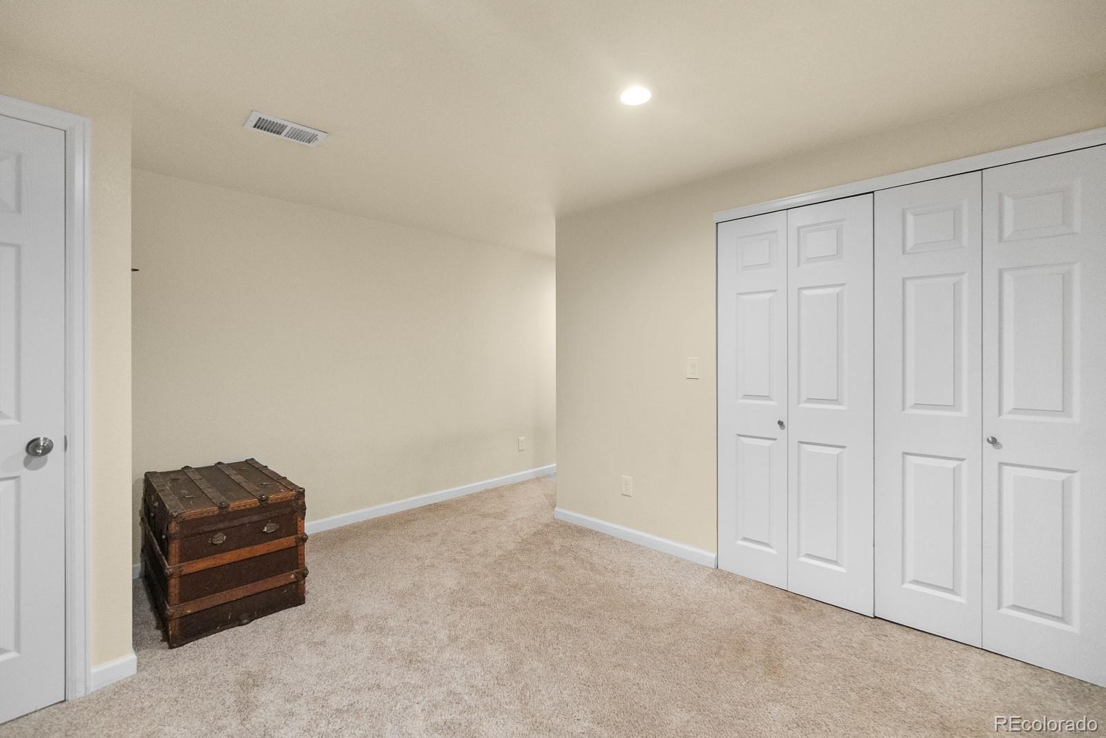3163 Windstream Lane Elizabeth, CO 80107 - Photo 24 of 48 a room with a dresser