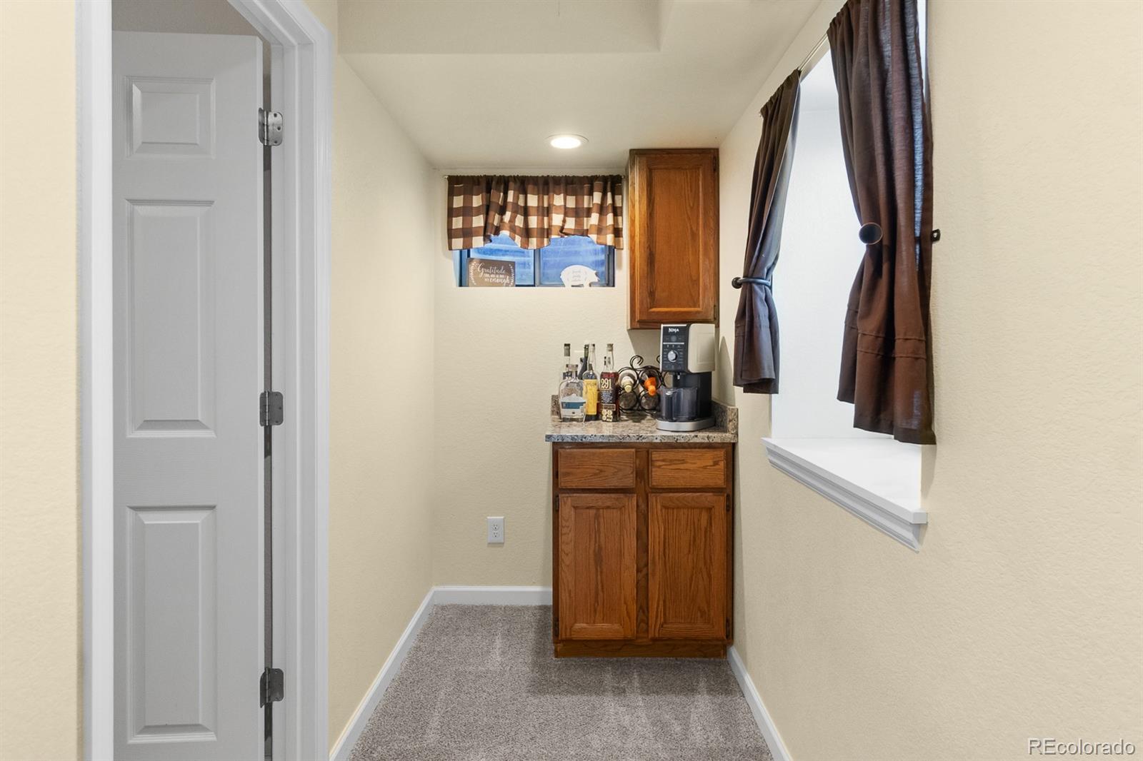 3163 Windstream Lane Elizabeth, CO 80107 - Photo 27 of 48 a room with window and mirror