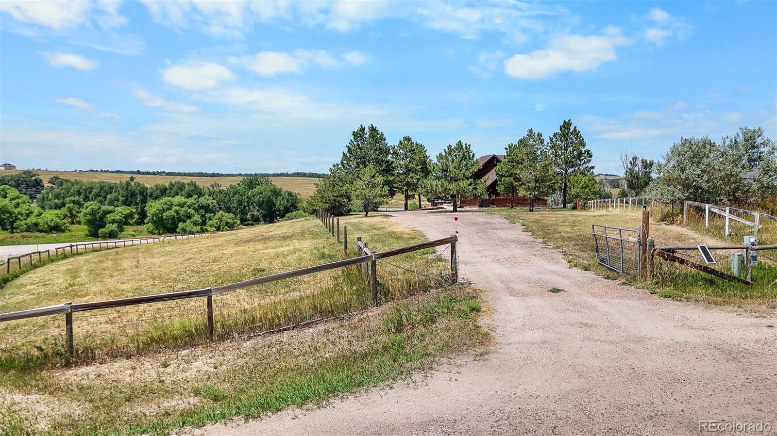 3163 Windstream Lane Elizabeth, CO 80107 - Photo 42 of 48 a view of a pathway with a wrought fence